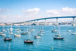 San Diego waterfront with sailing Boats - Indutrial harbor and Coronado Bridge